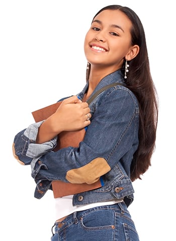 Sophia smiles confidently with textbooks in hand.
