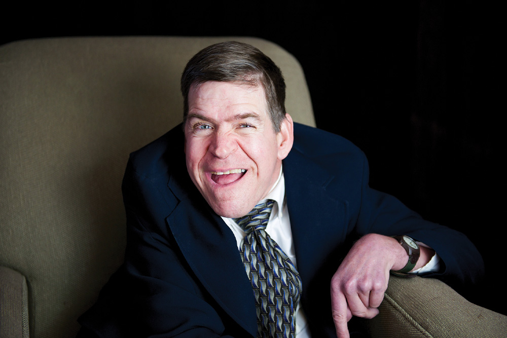 John G. Smith (1959-2025).