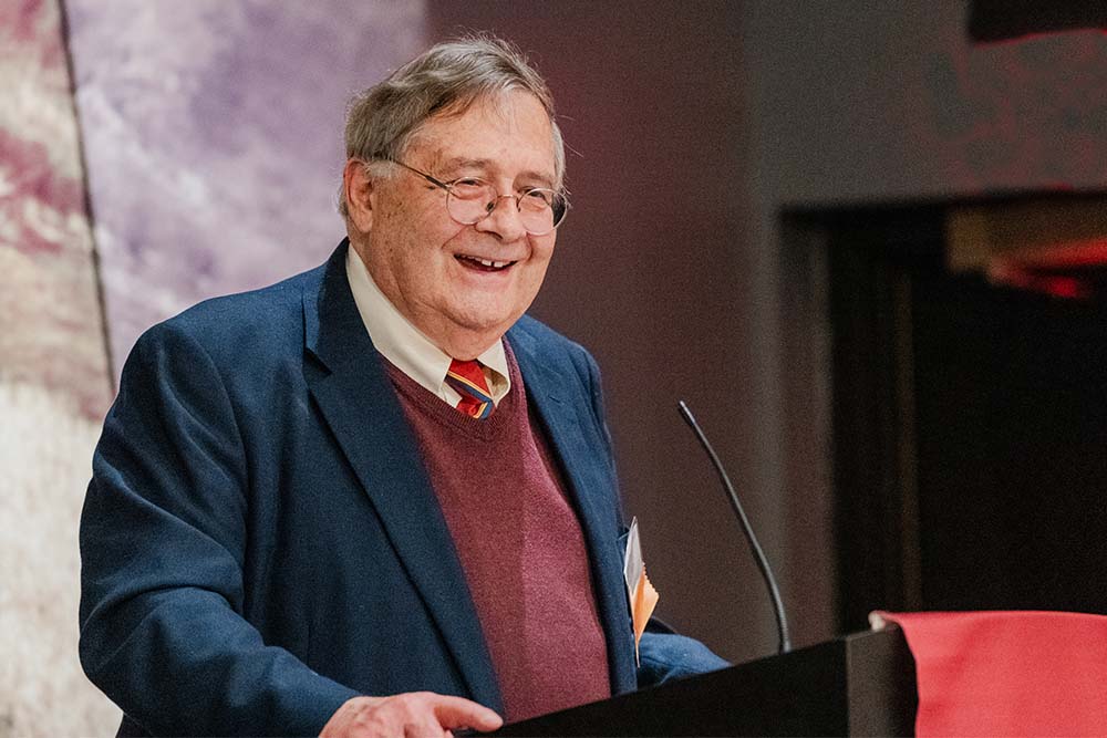 K. Charlie Lakin speaks from a lectern during the award ceremony.