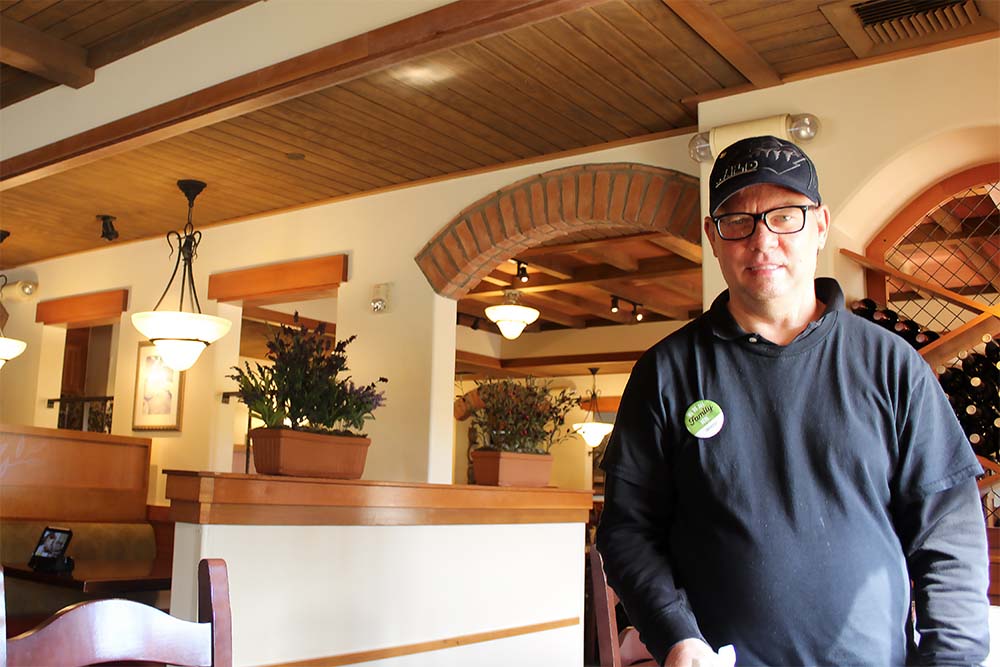 Brady Berg, who has disabilities, works part-time as a busser at an Olive Garden restaurant.