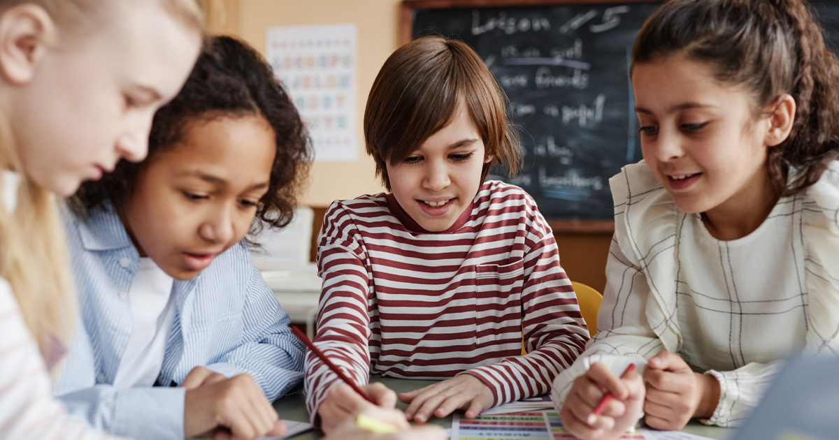 School children work on a group project in an integrated classroom.