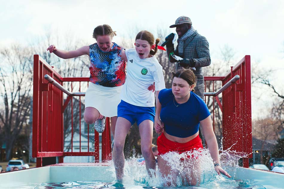 three teens jump into a plunge pool