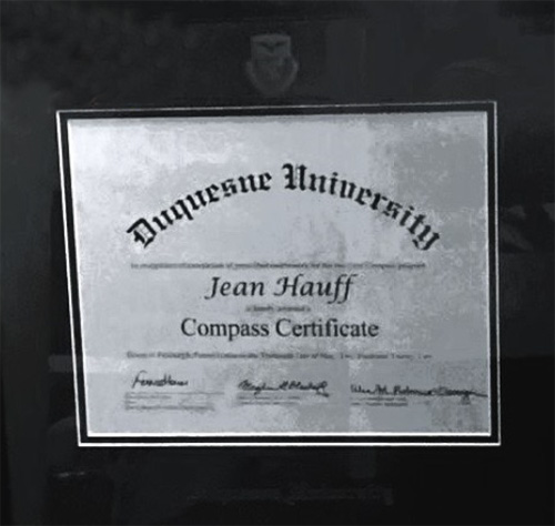 Jean Hauff’s Duquesne University Compass Certificate with three signatures from University faculty or staff.