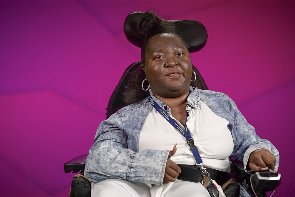 Shanell Davis is an advocacy support professional in Buffalo, New York. She speaks in one of the videos. She is a Black woman who uses a wheelchair.