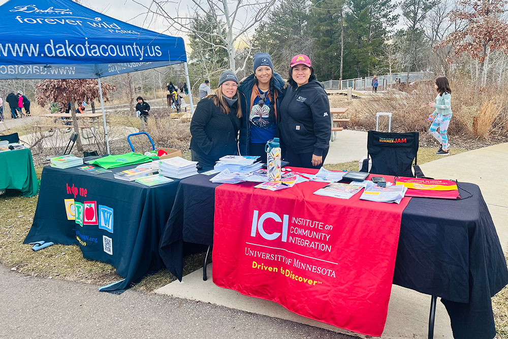 Erika Lamboglia (MNLEND 2021-22), Fanny Fernandez (MNLEND 2023-24), and ICI's Andrea Castillo promote resources to families with autism at a community event in the Twin Cities.